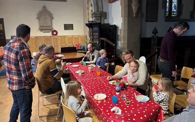 Dads and children sitting around a table at Dads and Tots in Maresfield Church