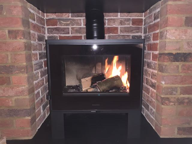 A Panadera Java 3 stove in a living room