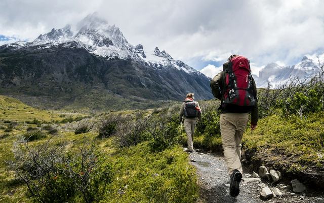 Walkers on a hillside path